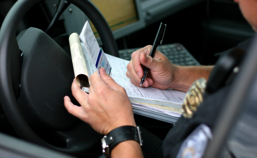 Police officer writing ticket