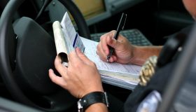 Police officer writing ticket